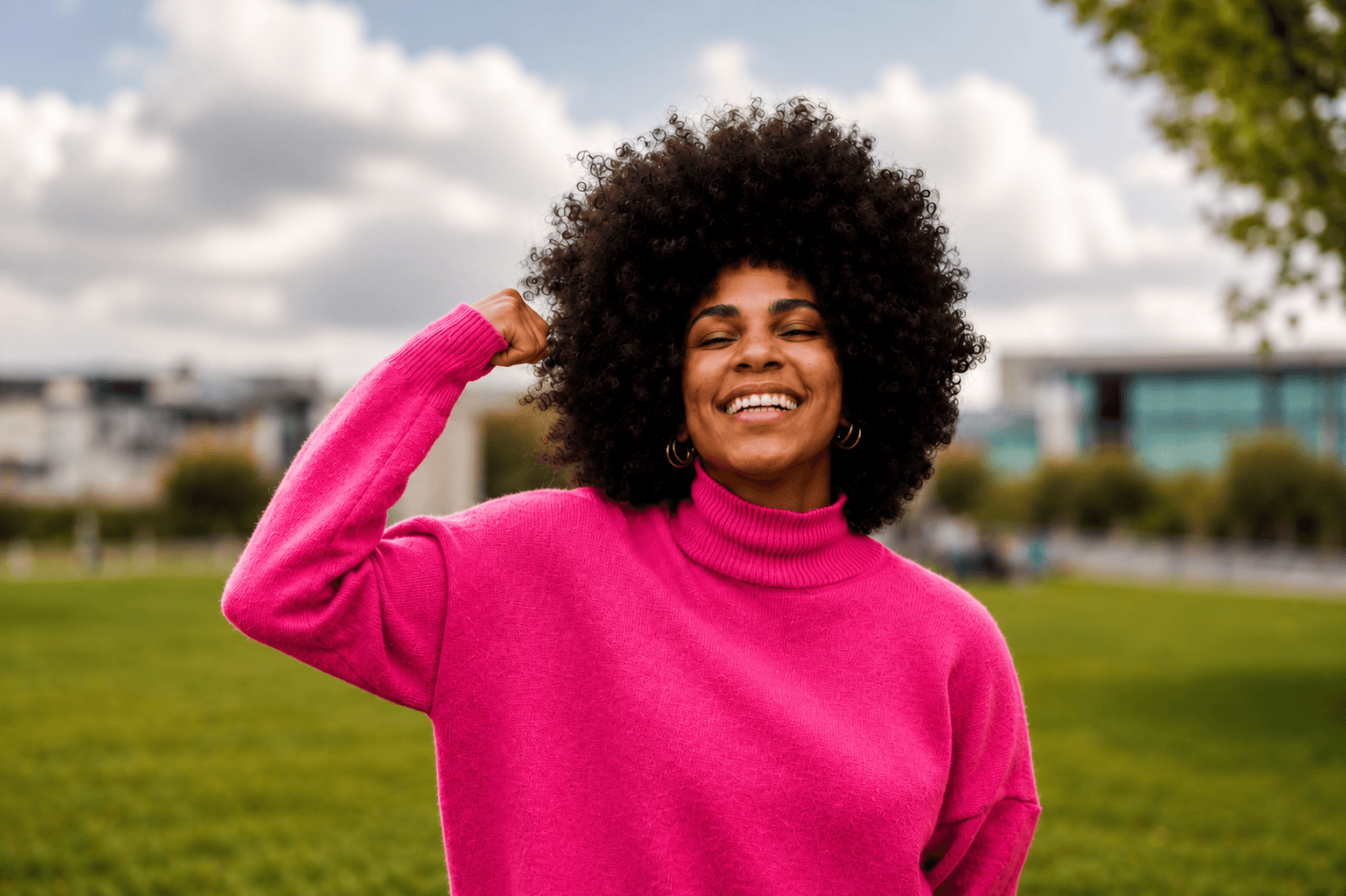 Woman flexing with confidence and joy